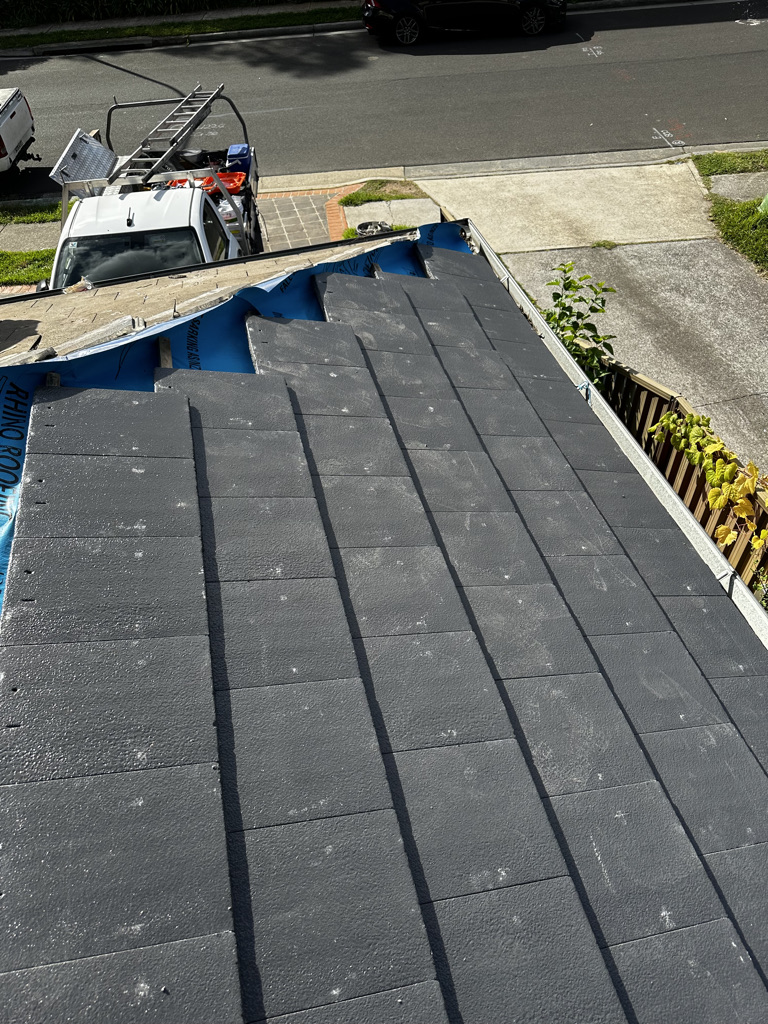 a roof of a house with a roof receiving repairs