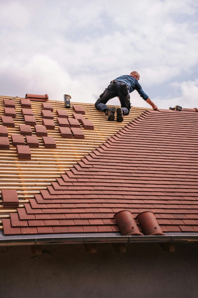 Person fixing the roof