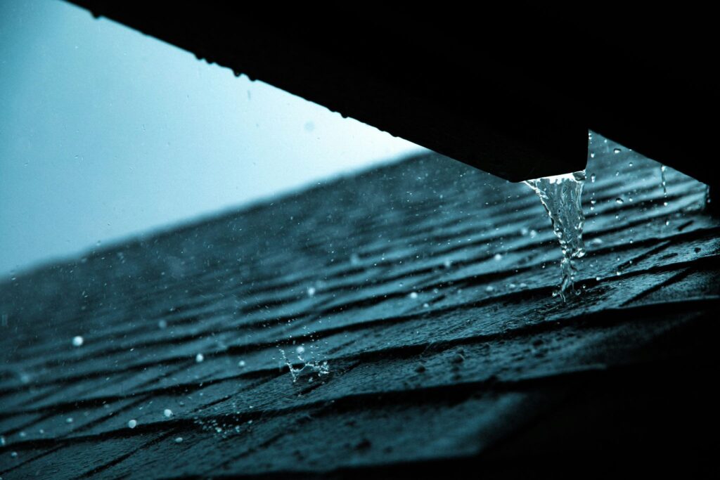 Water running over roof tiles, roof leak