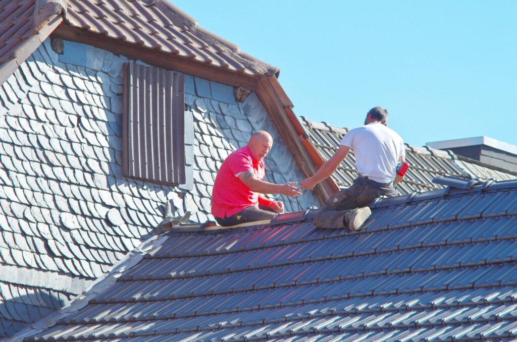 two men working on roof